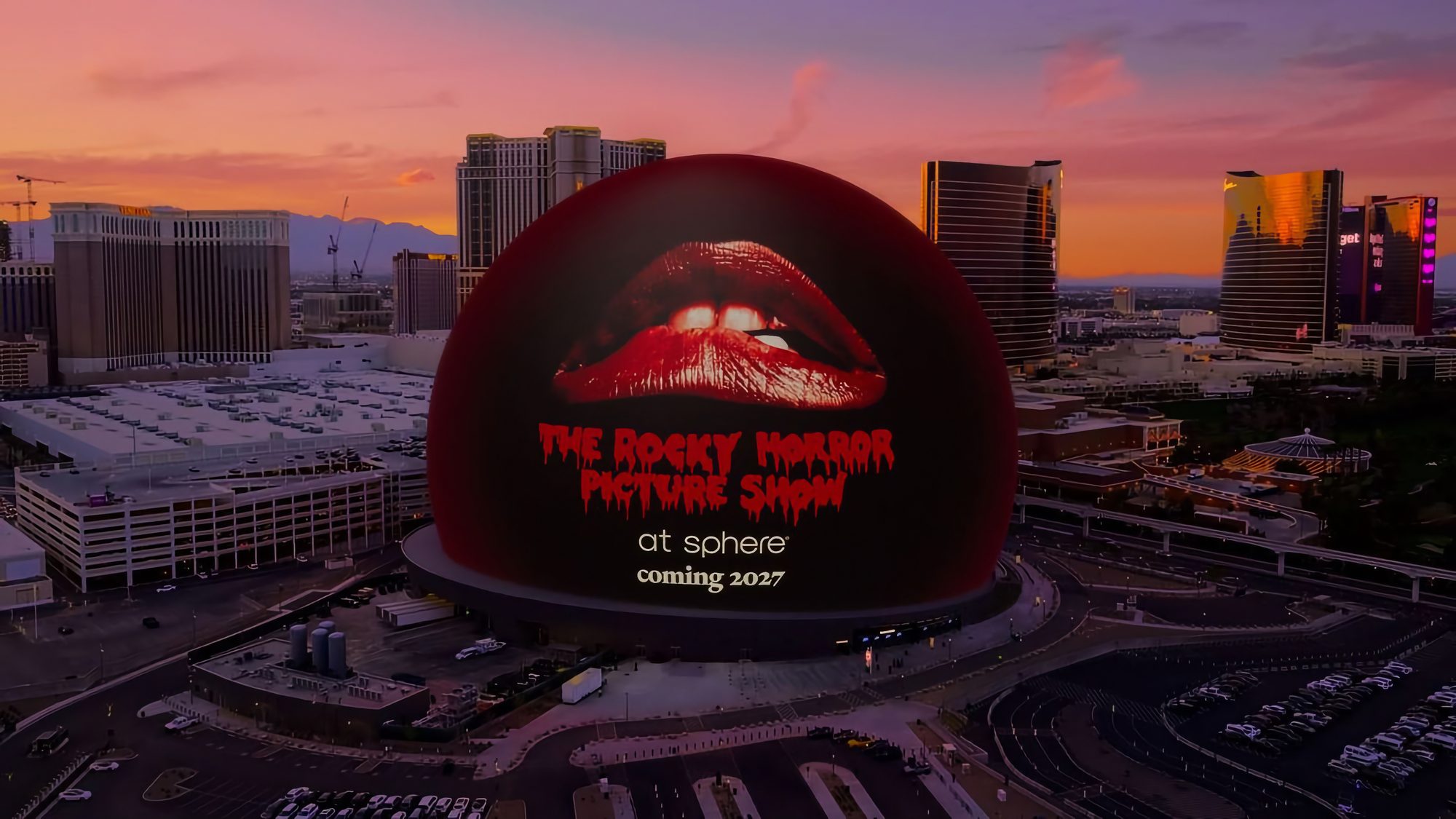 The Sphere on the Las Vegas Strip at sunset, its exterior lit up as a giant screen